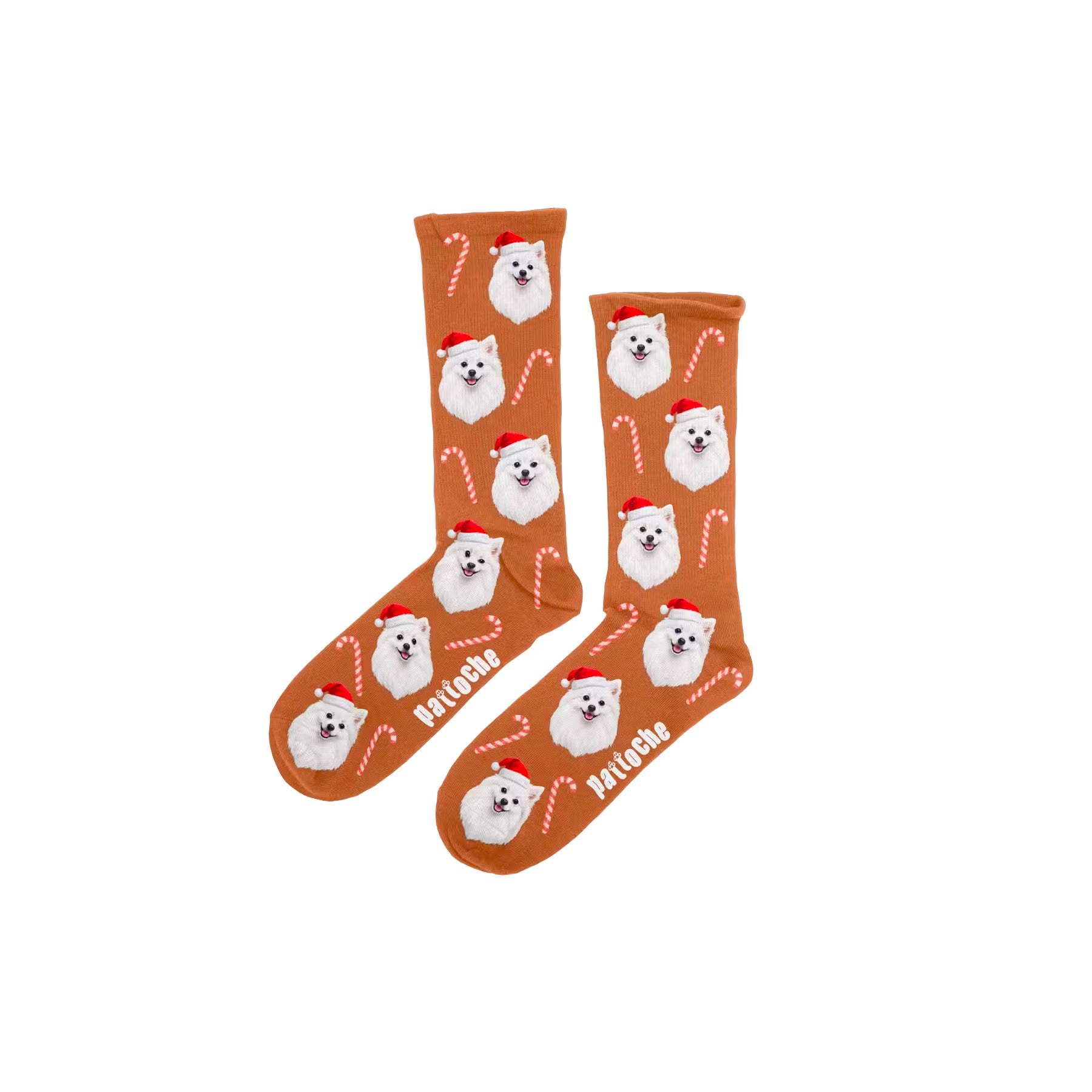 Chaussettes de Noël pour enfant brunes avec motifs sucres d’orge et une tête de chien blanc